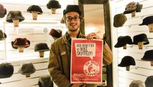Silas holding a poster says: No to tax heavens